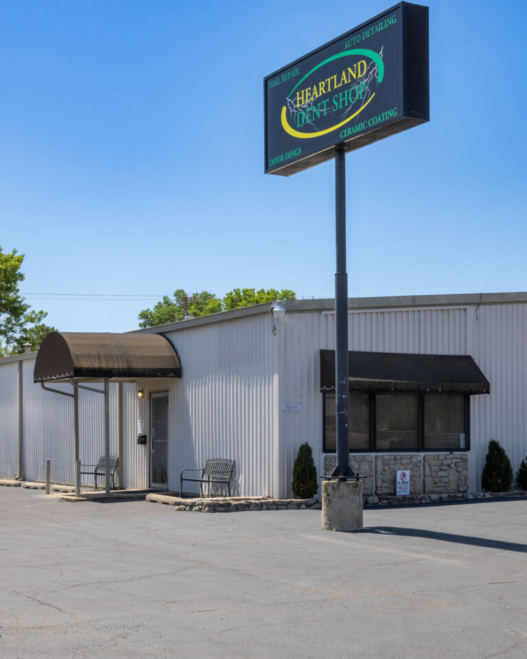 Heartland Dent Shop building and sign at 8618 E 46th St in Tulsa, listing hail repair, auto detailing, ceramic coating and door dings.