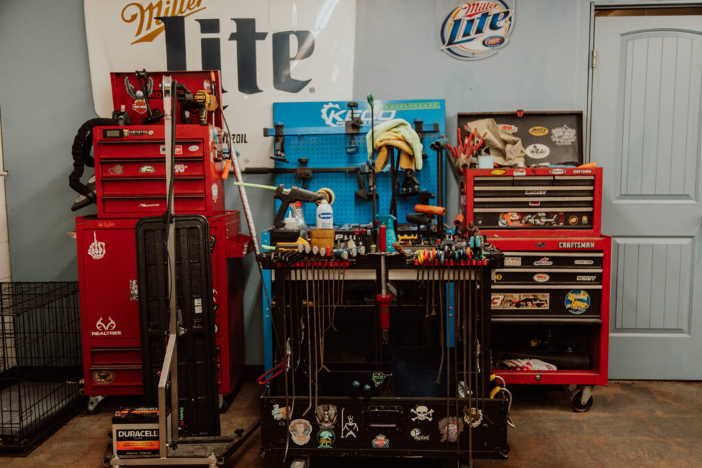Paintless dent repair rods, glue-pull tabs and tool chests at Heartland Dent Shop in Tulsa.